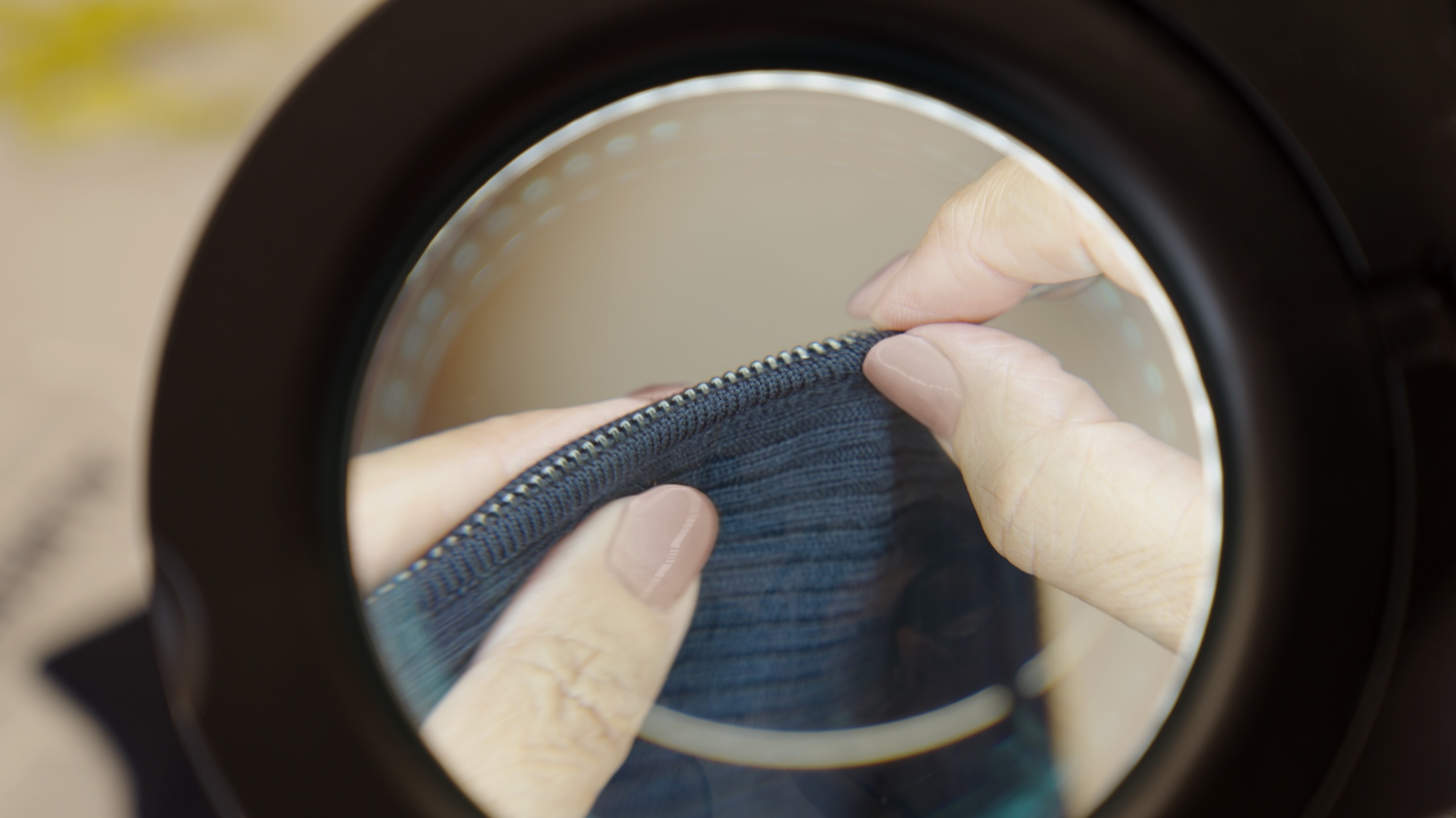 Cashmere knit construction inspected under magnification